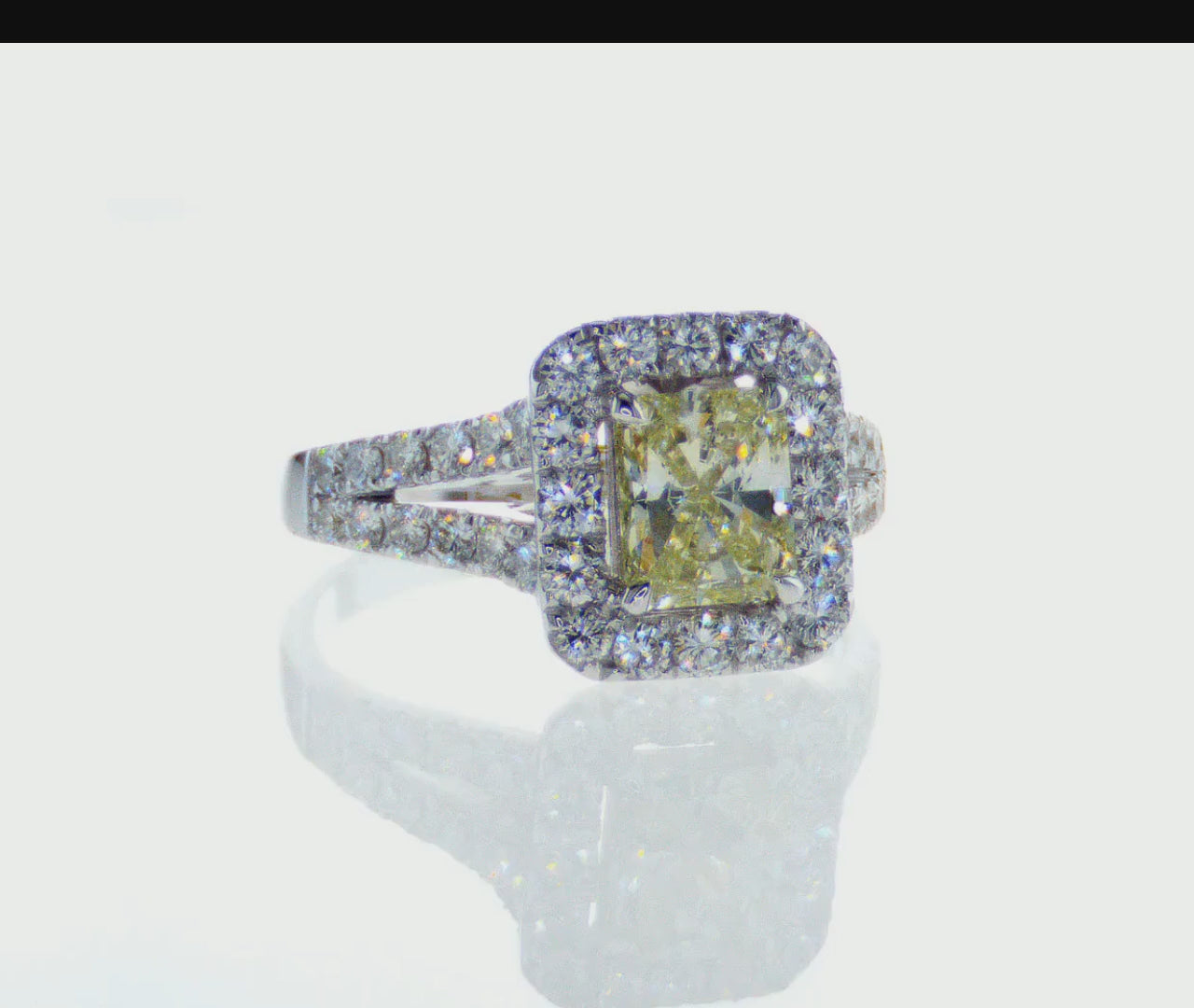 square yellow diamond stone with white diamonds around